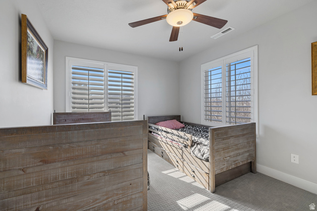 2745 Red Barn Road South Heber City, UT 84032 - Photo 21 of 51 Unfurnished bedroom with carpet flooring, a ceiling fan, and multiple windows
