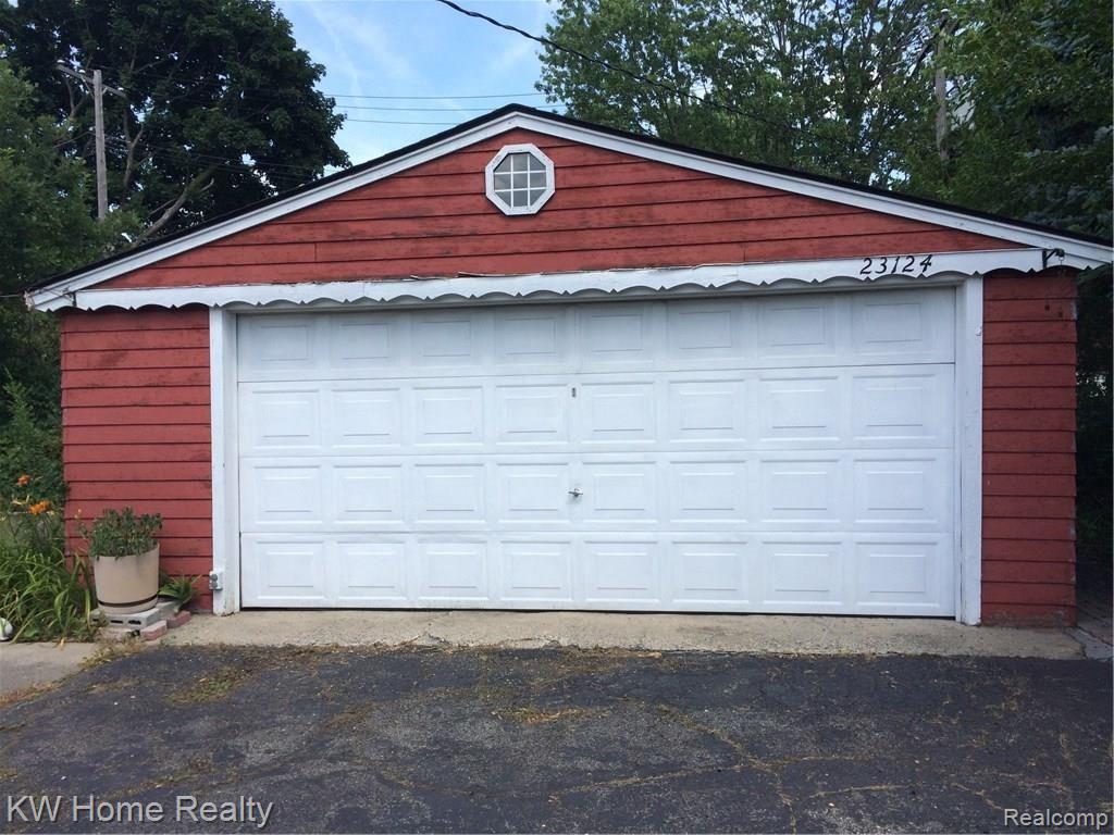 23124 Farmington Road Farmington, MI 48336 - Photo 39 of 42 2+ Car Garage with Door Opener and Electricity has Space for Workbench and Additional Storage