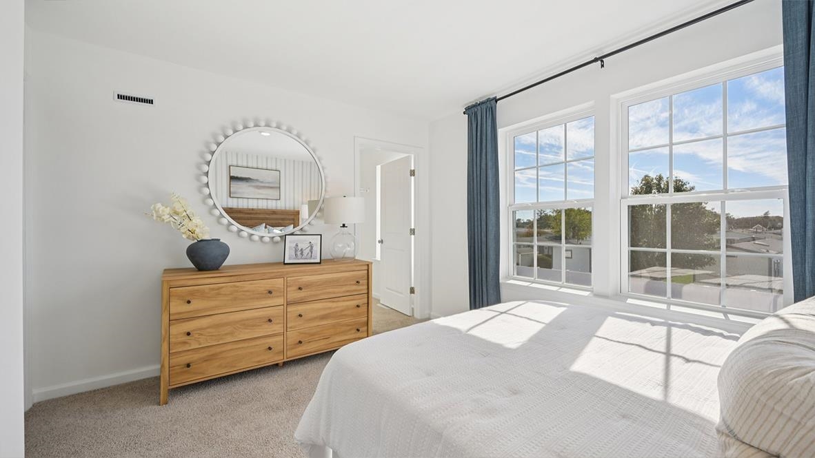 506 Scotty, Unit 1204 Rio Grande, NJ 08242 - Photo 39 of 44 a bedroom with a bed and a window