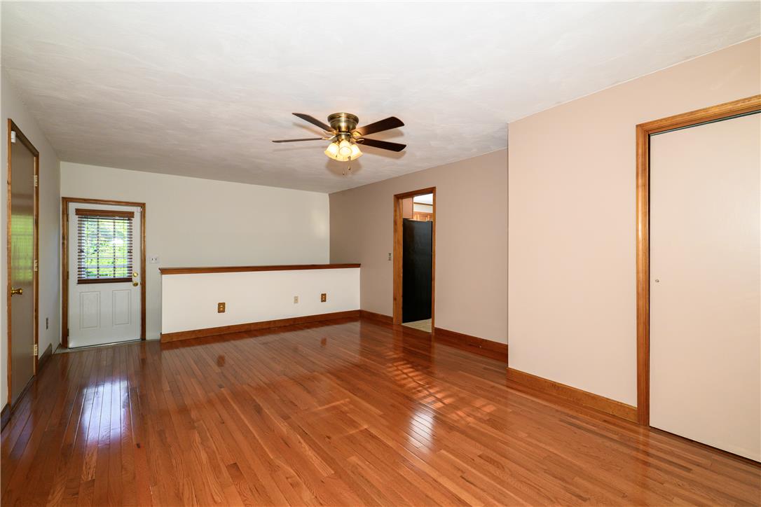 1644 9th Street Bethlehem, PA 18020 - Photo 11 of 27 Gleaming hardwood floors and a ceiling fan enhance this inviting open living space.