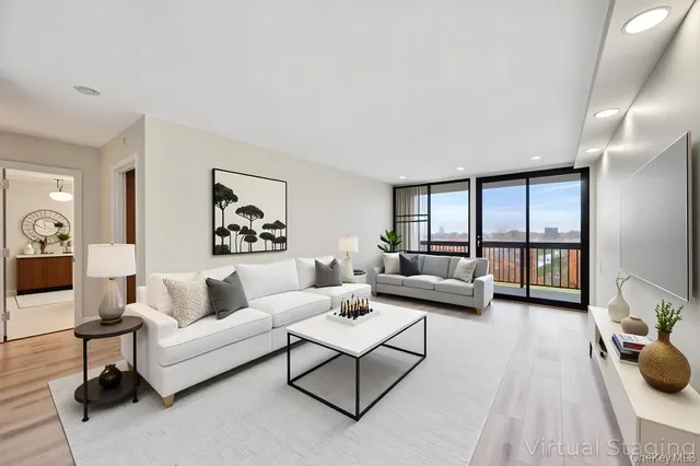 a living room with furniture and a large window