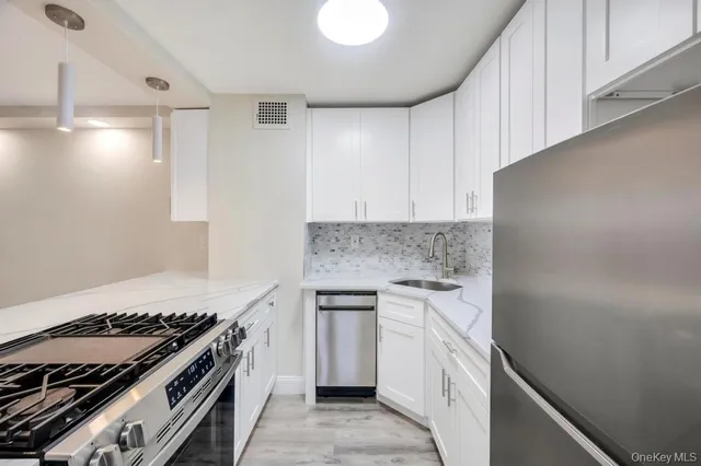 a kitchen with a stove and a sink