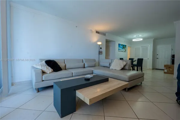 a living room with furniture and a couch