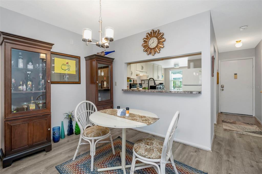 9617 Brassie Court New Port Richey, FL 34655 - Photo 11 of 41 a view of a dining room with furniture and chandelier
