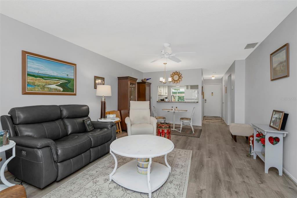 9617 Brassie Court New Port Richey, FL 34655 - Photo 15 of 41 a living room with furniture and a wooden floor