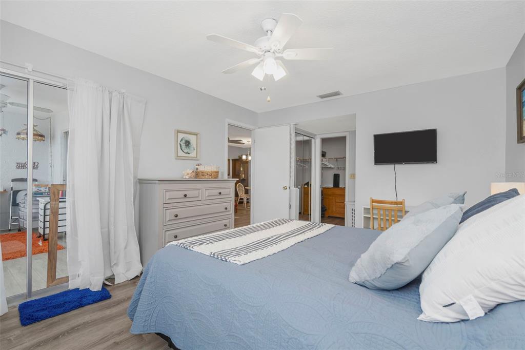 9617 Brassie Court New Port Richey, FL 34655 - Photo 17 of 41 a bedroom with a bed and a television
