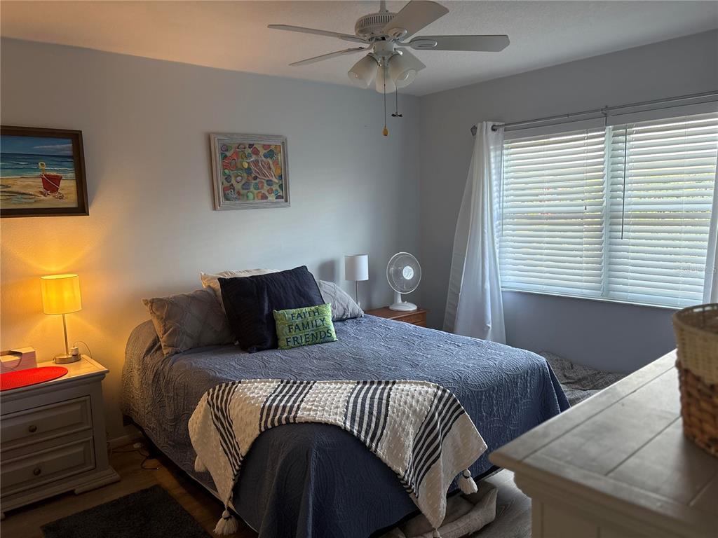 9617 Brassie Court New Port Richey, FL 34655 - Photo 21 of 41 a bedroom with a bed and window
