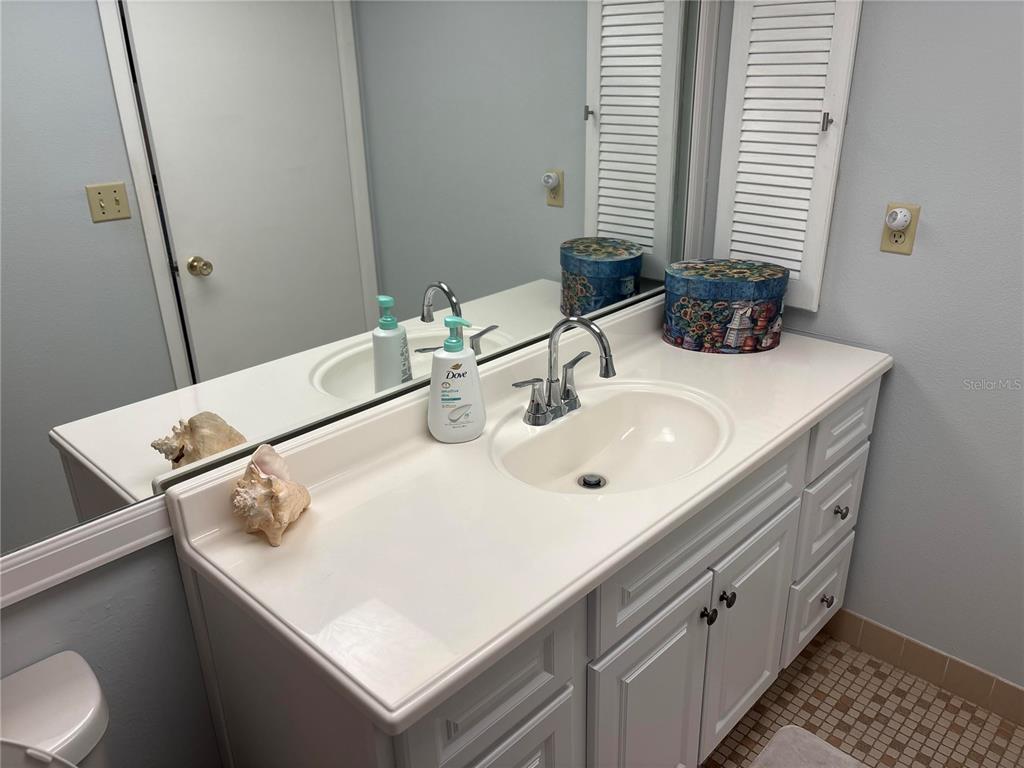 9617 Brassie Court New Port Richey, FL 34655 - Photo 22 of 41 a bathroom with a sink and a mirror