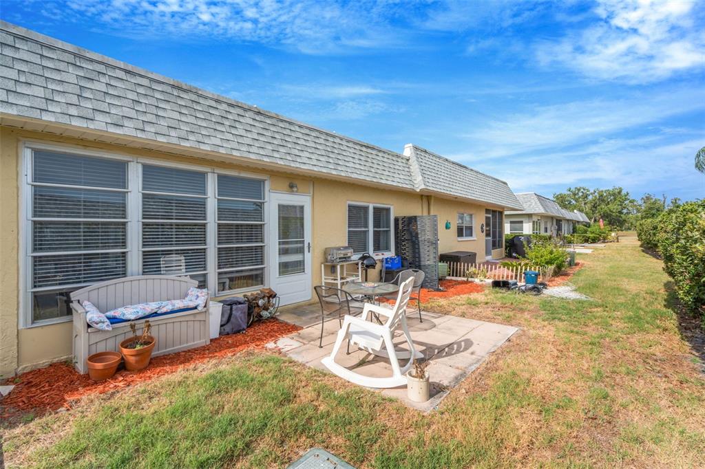 9617 Brassie Court New Port Richey, FL 34655 - Photo 34 of 41 a view of a lounge chairs in the patio