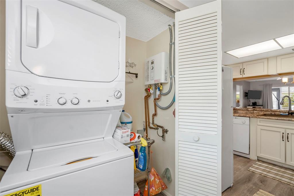 9617 Brassie Court New Port Richey, FL 34655 - Photo 7 of 41 a utility room with dryer and washer