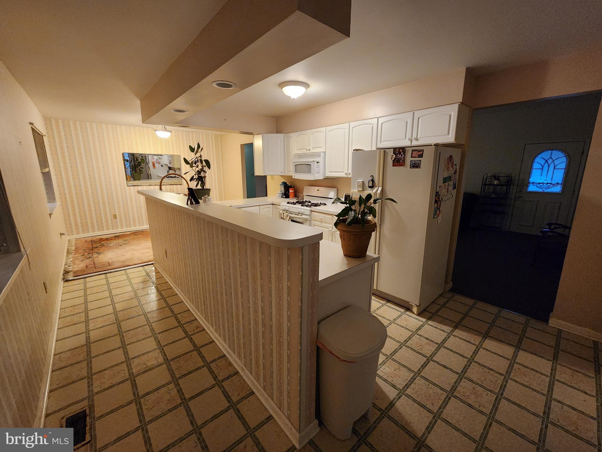 22 Theodore Avenue Maple Shade, NJ 08052 - Photo 21 of 33 a view of a kitchen with fridge and workspace