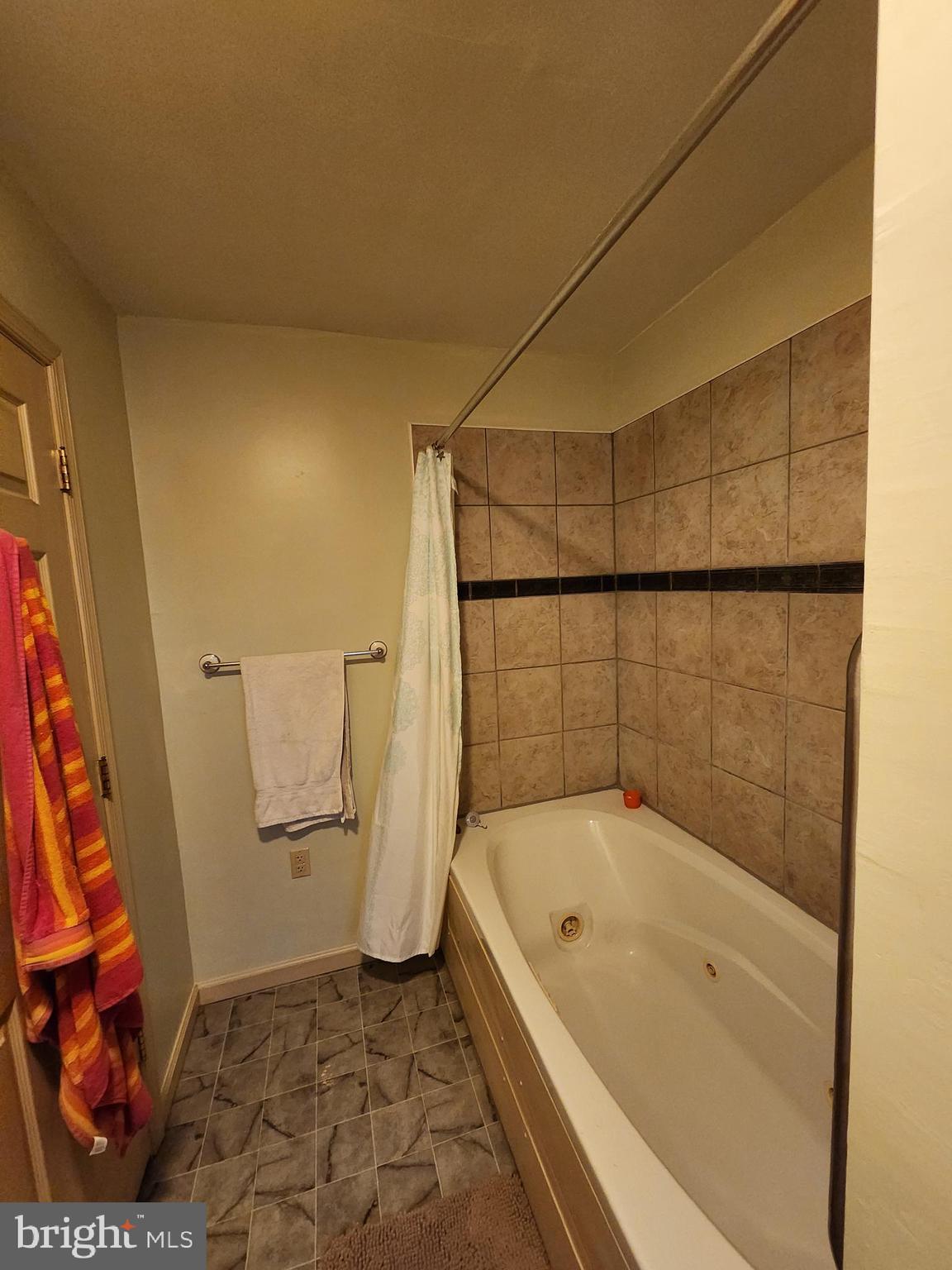 22 Theodore Avenue Maple Shade, NJ 08052 - Photo 10 of 33 a bathroom with a bathtub and a shower