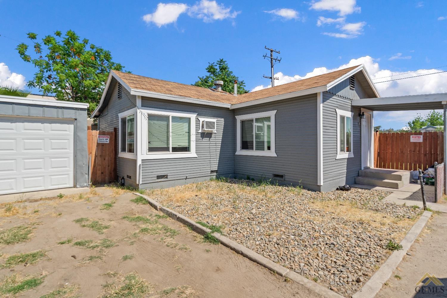 a house with trees in front of it