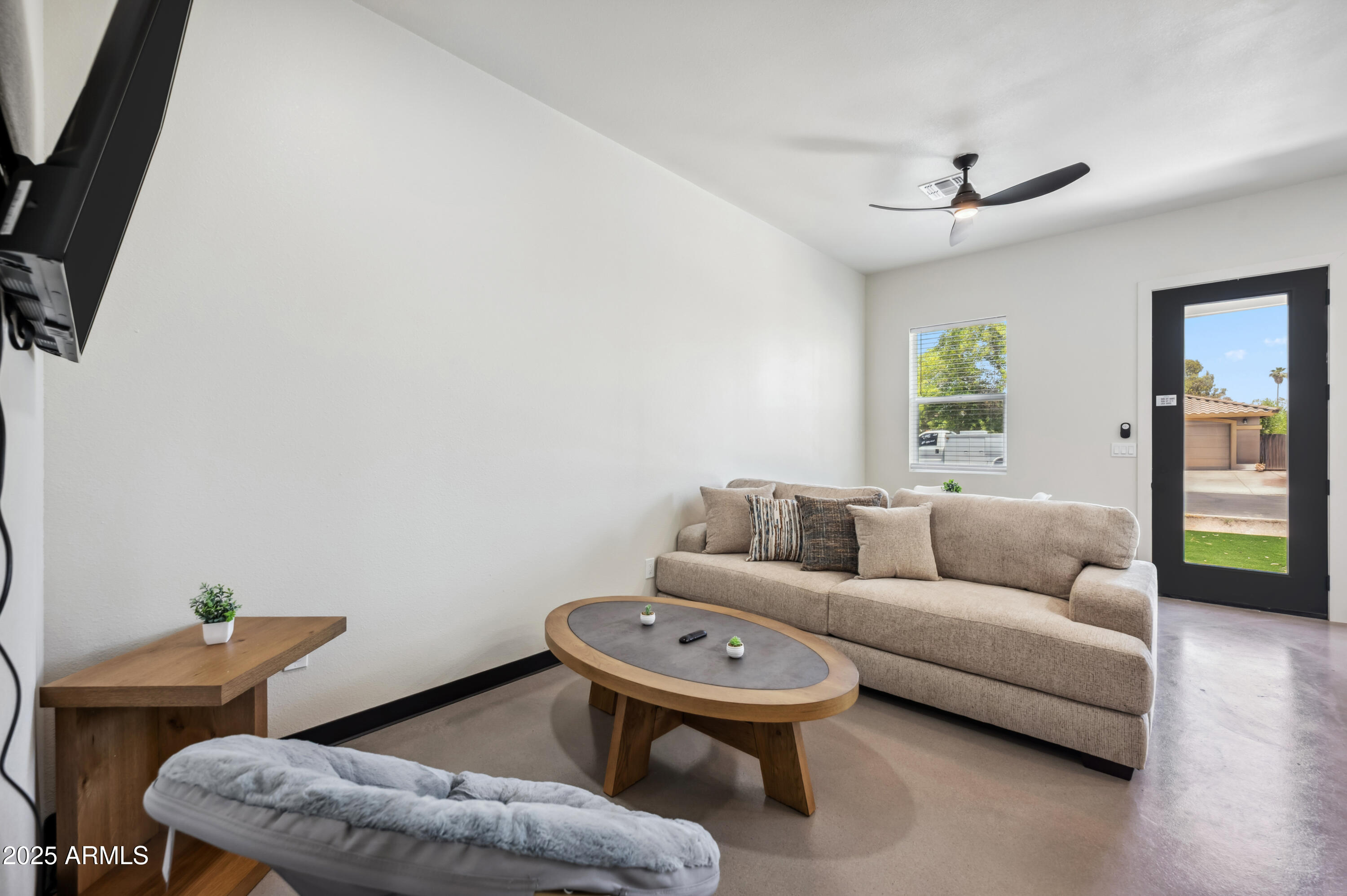 4132 North 11th Street Phoenix, AZ 85014 - Photo 13 of 33 a living room with furniture and a wooden floor