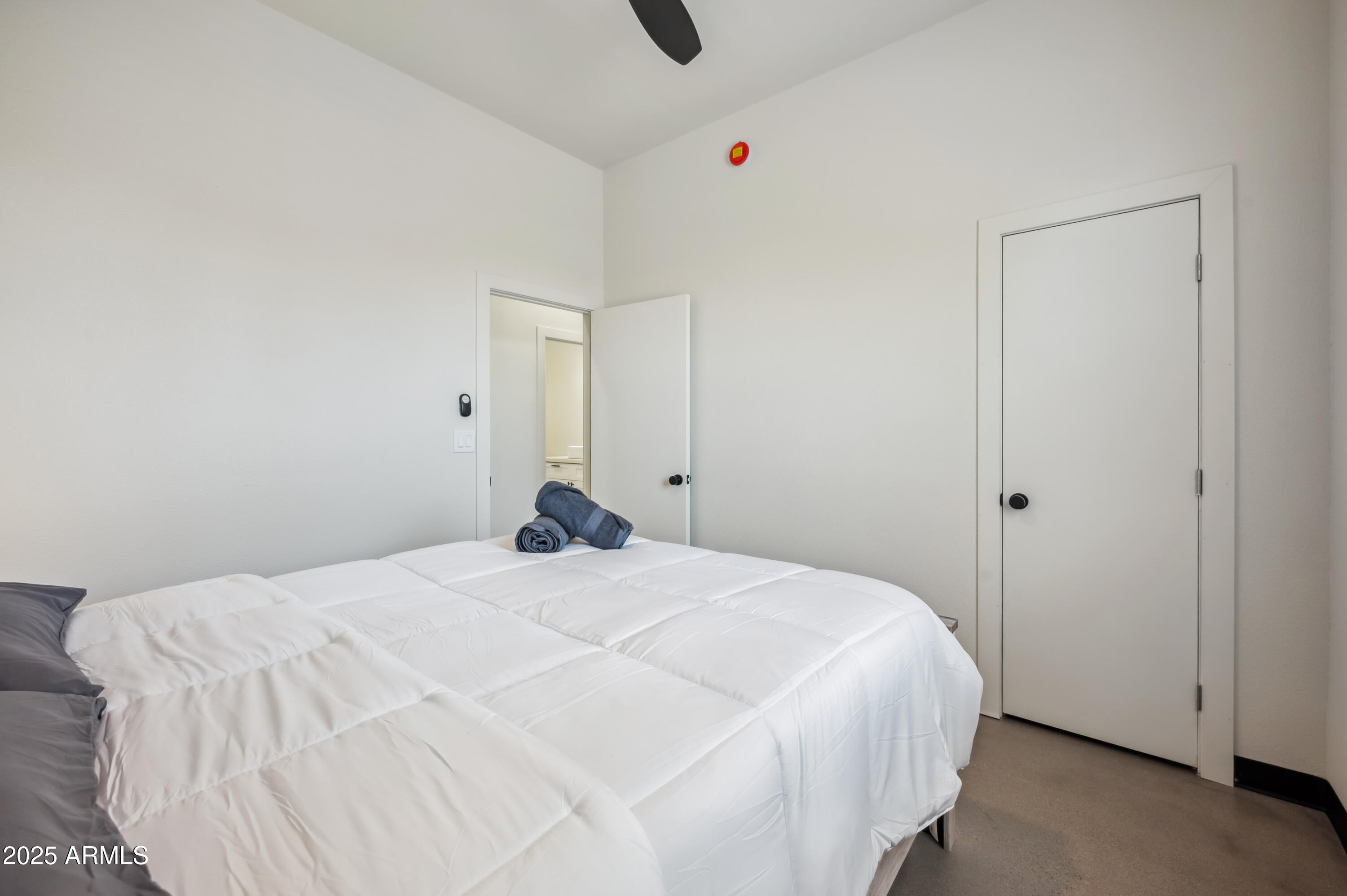 4132 North 11th Street Phoenix, AZ 85014 - Photo 22 of 33 a bedroom with a bed and cabinets
