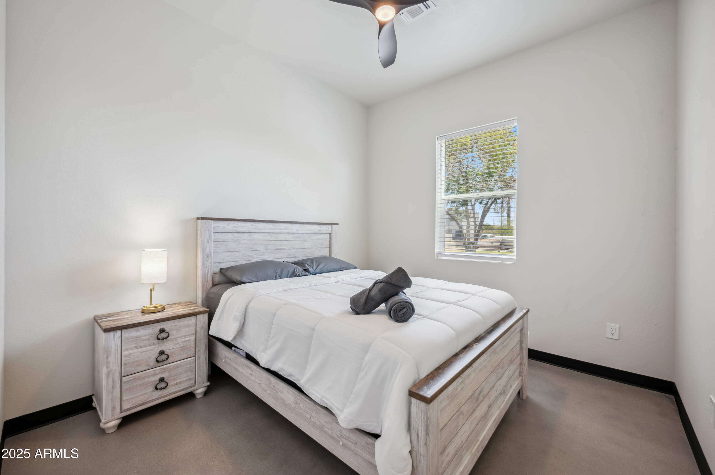 4132 North 11th Street Phoenix, AZ 85014 - Photo 23 of 33 a bedroom with a bed and a window