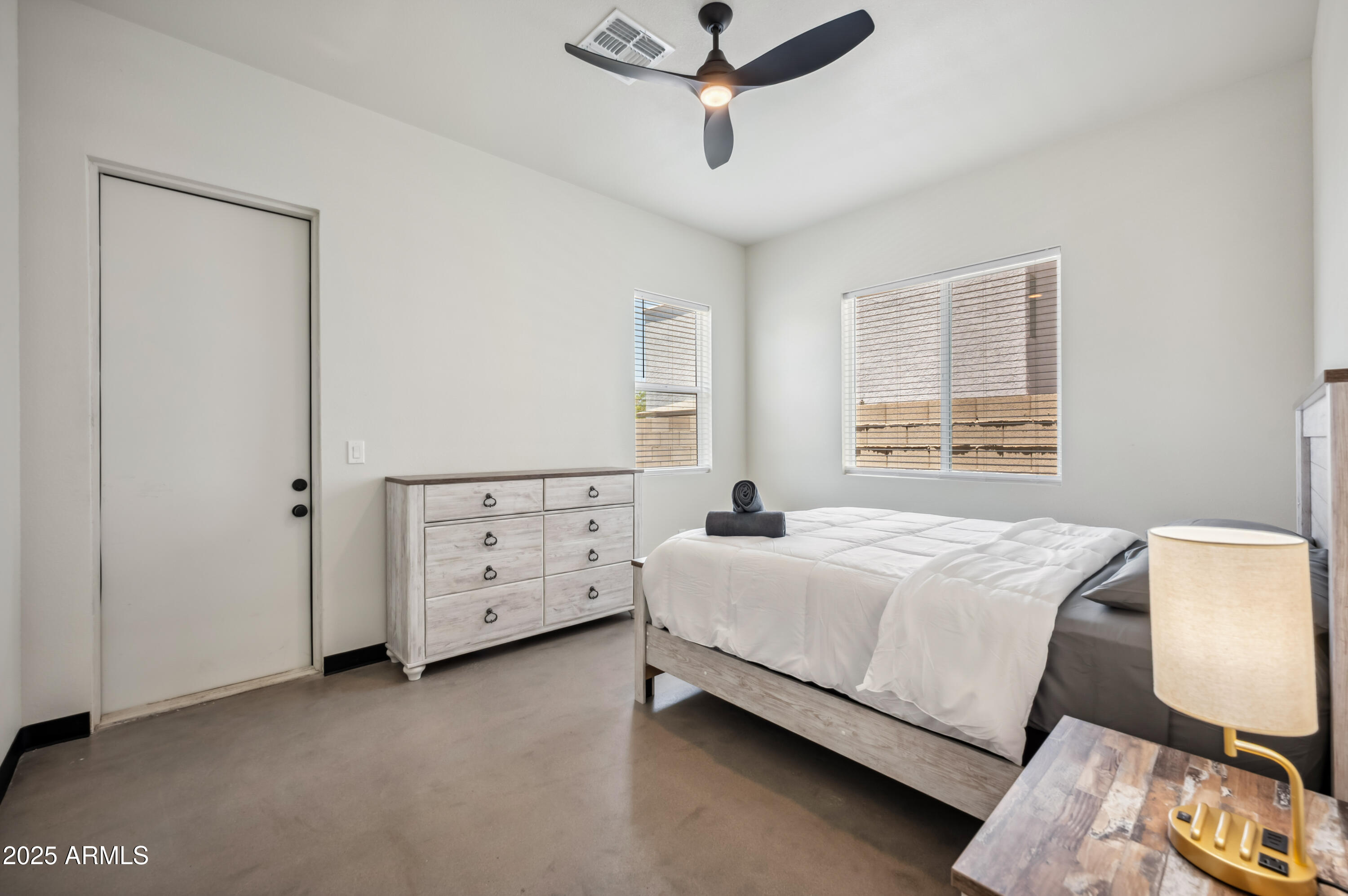 4132 North 11th Street Phoenix, AZ 85014 - Photo 25 of 33 a bedroom with a bed and a chandelier