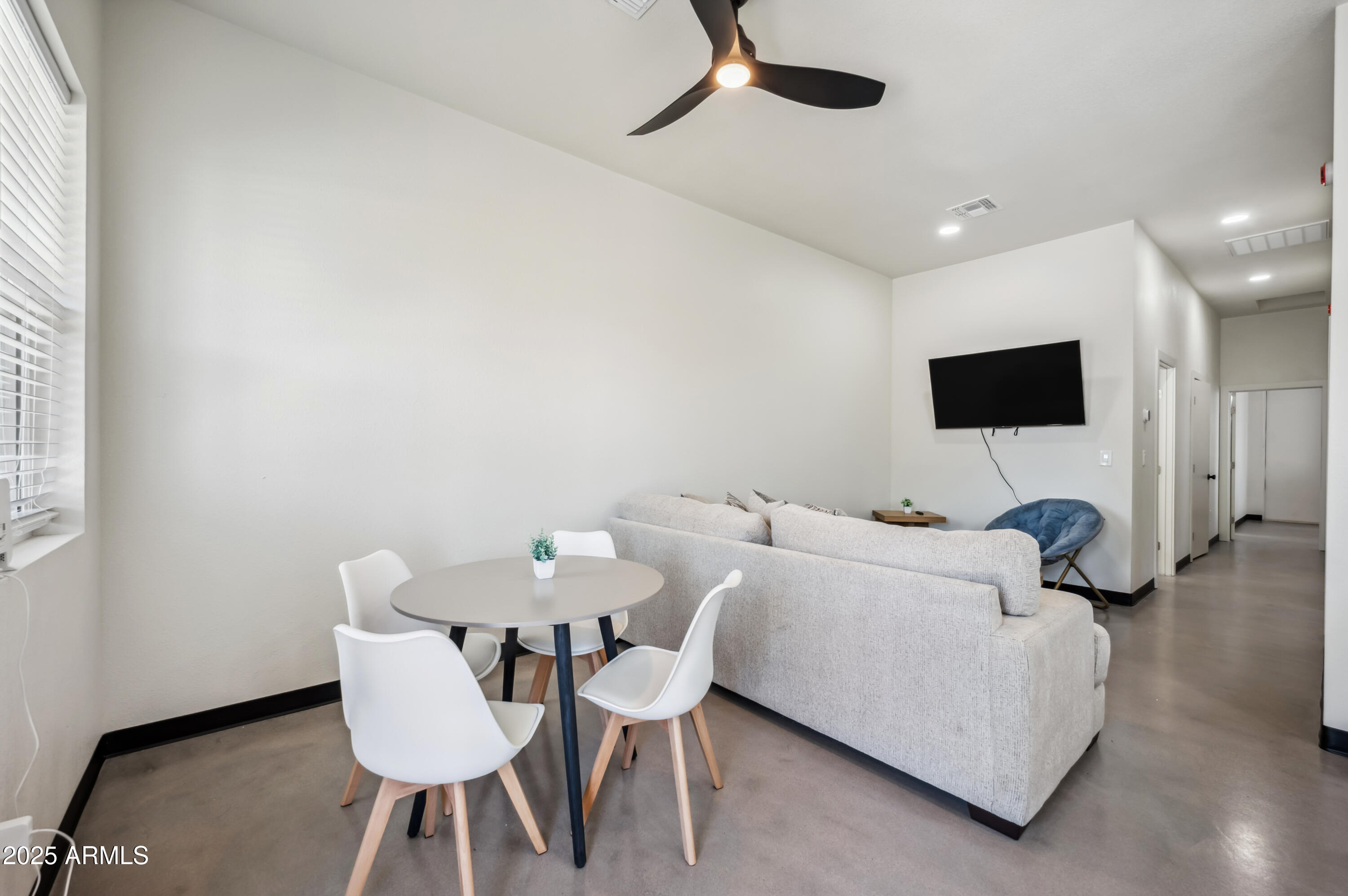 4132 North 11th Street Phoenix, AZ 85014 - Photo 6 of 33 a living room with furniture and a flat screen tv