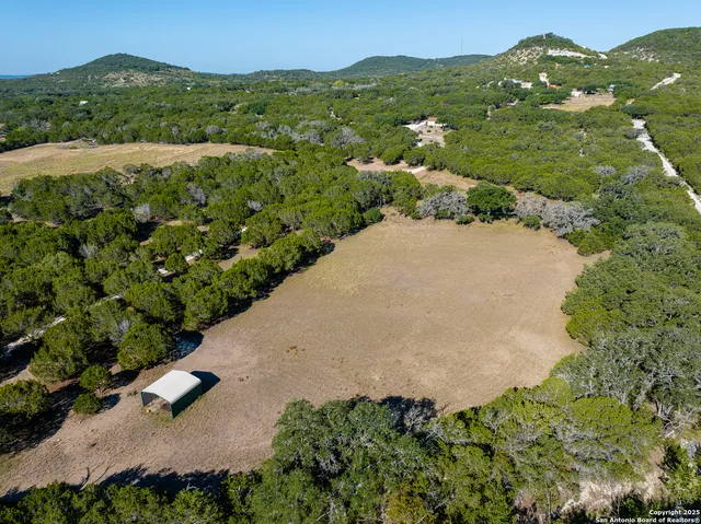 an aerial view of a house with a garden