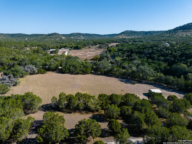 an aerial view of a house with mountain view