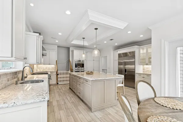 a kitchen with a sink stove and wooden cabinets