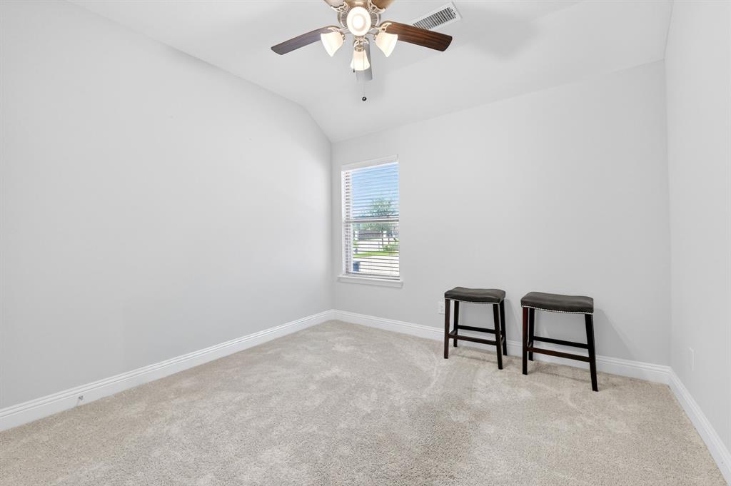 136 Gleeson Drive Red Oak, TX 75154 - Photo 30 of 40 an empty room with windows and fan