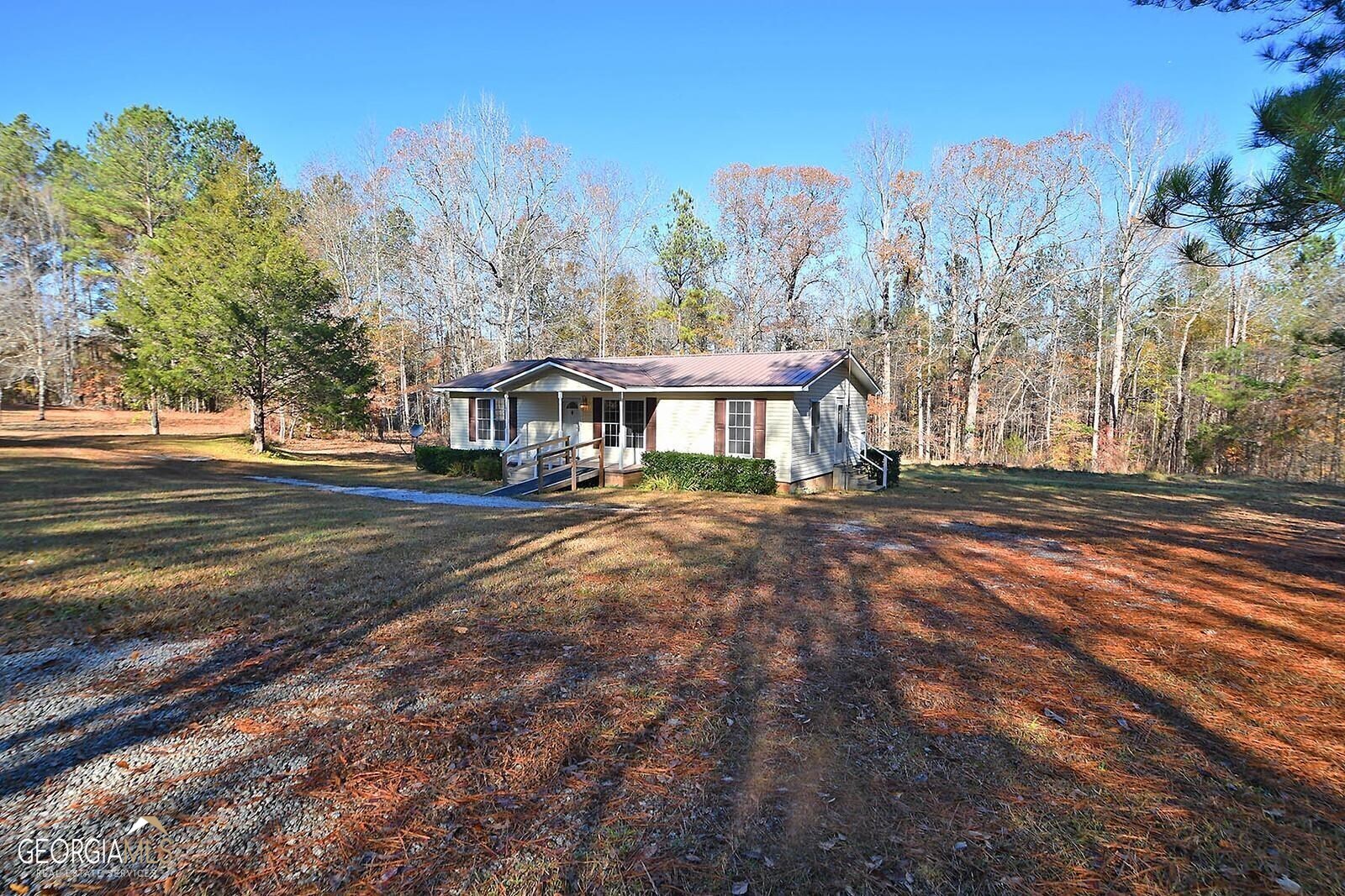 221 Patterson Road Franklin, GA 30217 - Photo 1 of 1 a front view of a house with a yard and mountain view