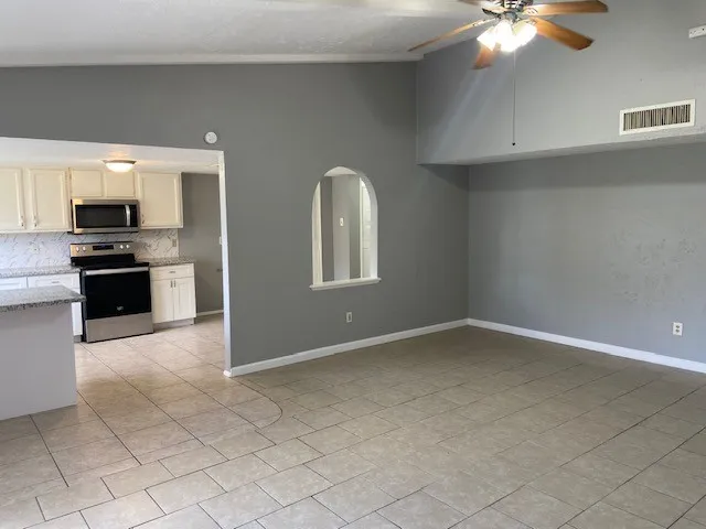 a view of a kitchen with a sink cabinets and a kitchen counter top space