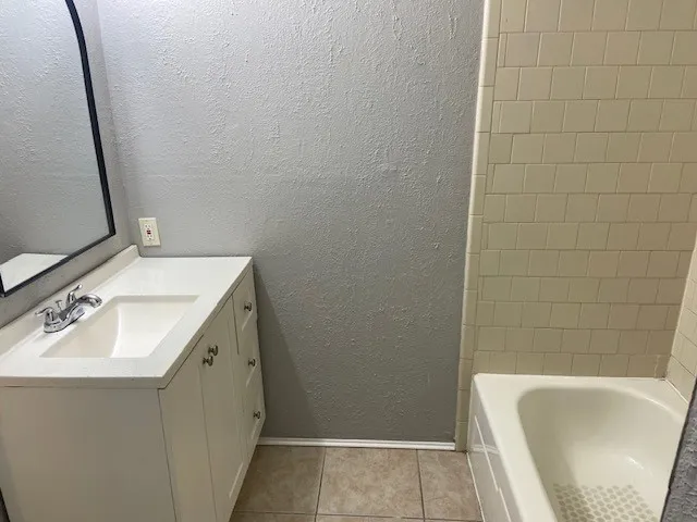 a bathroom with a sink and a bathtub