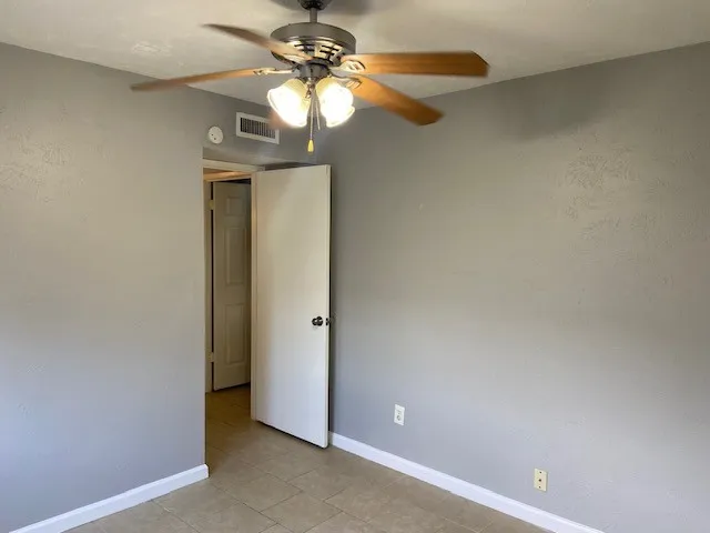 a view of a chandelier fan and a fan