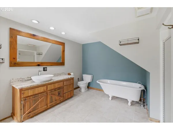 a bathroom with a granite countertop sink a mirror and a
