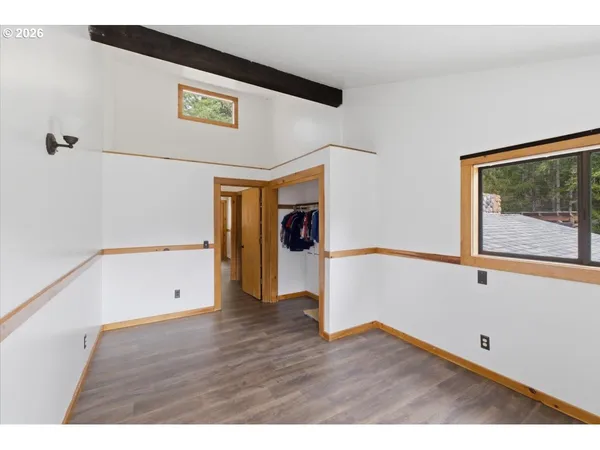 a view of hallway with wooden floor