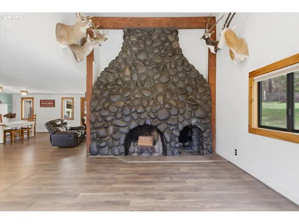 a view of a livingroom with furniture and a fireplace