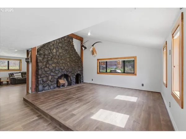 a view of a livingroom with furniture and a fireplace