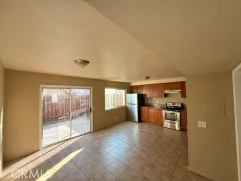 a view of a kitchen with refrigerator stove and kitchen