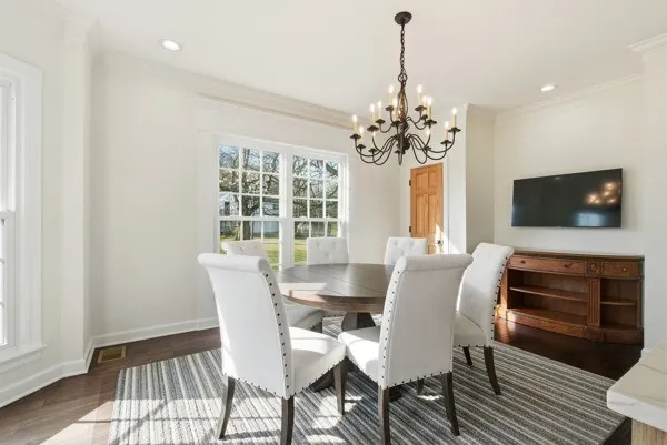 a bed room with a bed and a chair