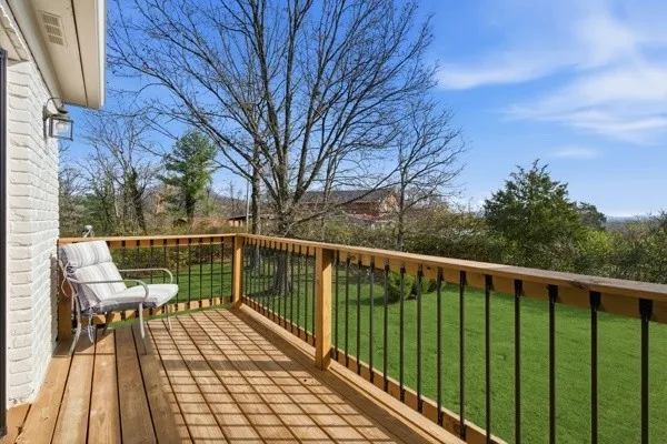 a spacious bathroom with a granite countertop sink and a mirror