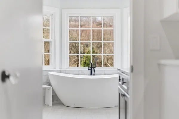 a bedroom with a bed and a couch