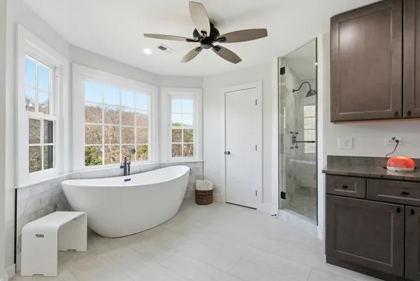 a spacious bedroom with a bed and a window