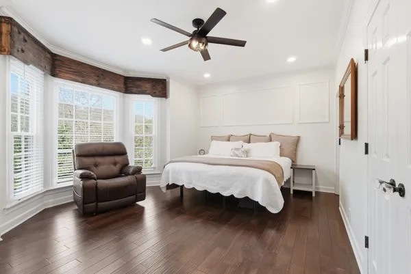 a balcony view with a couch and large trees