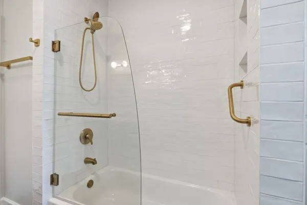 a view of a white house with a big yard and large trees