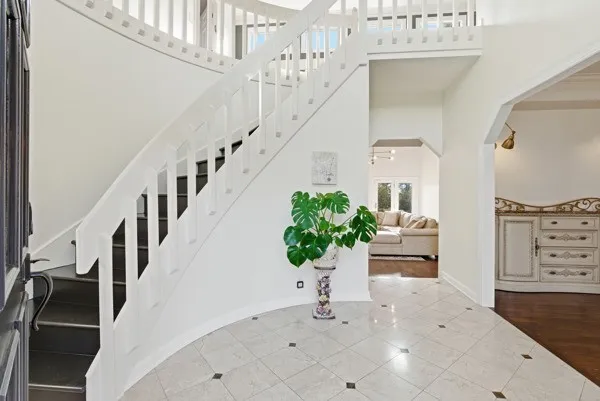 a living room with fireplace furniture and a wooden floor