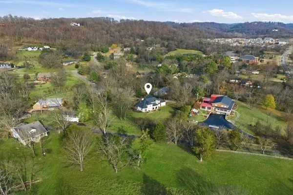 a car parked in the middle of a yard
