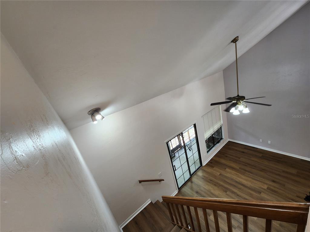 5823 Southwest 9th Place, Unit H55 Gainesville, FL 32607 - Photo 29 of 50 a view of an entryway with wooden floor