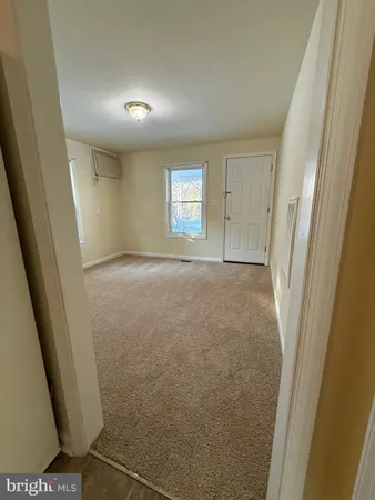 a view of empty room with windows