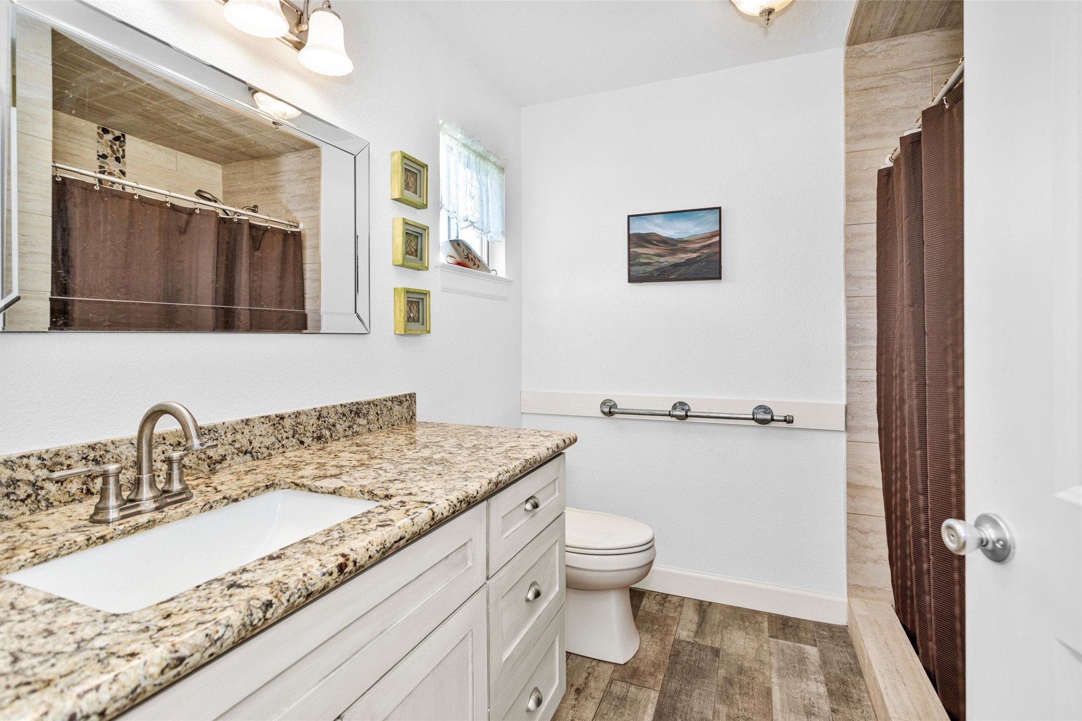 4402 Spears Road Manvel, TX 77578 - Photo 31 of 38 a bathroom with a granite countertop sink mirror vanity and toilet