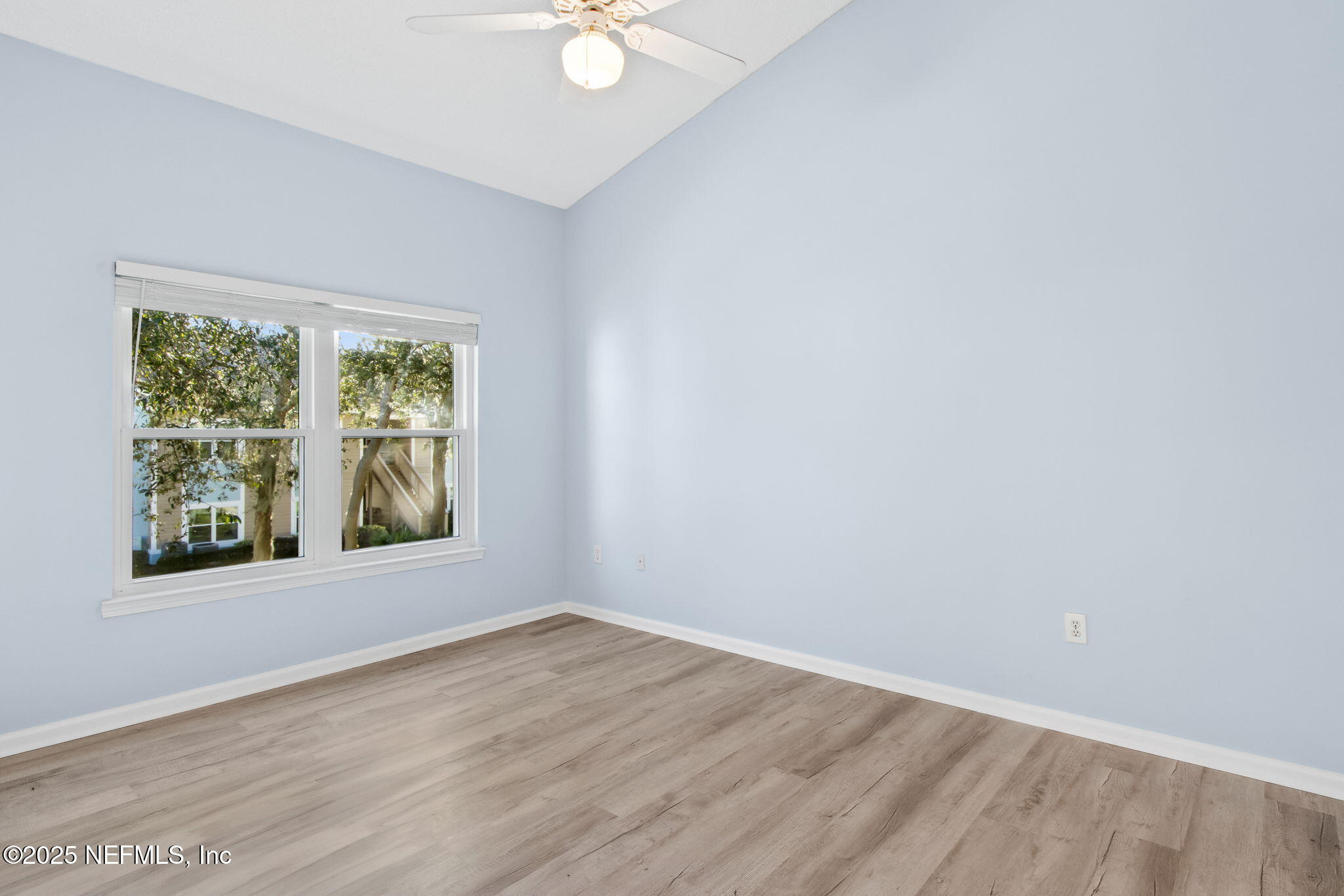 1601 Nectarine Street, Unit F6 Fernandina Beach, FL 32034 - Photo 20 of 57 an empty room with wooden floor and windows