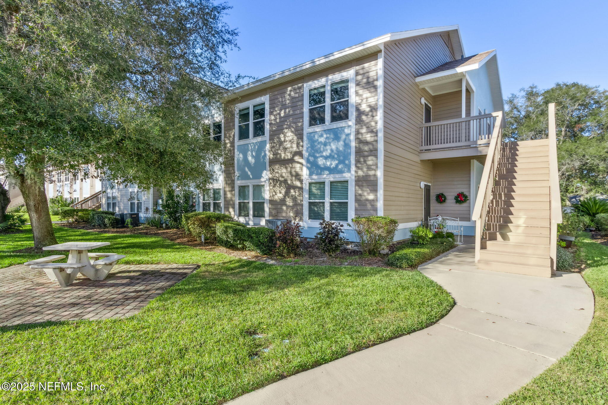 1601 Nectarine Street, Unit F6 Fernandina Beach, FL 32034 - Photo 2 of 57 front view of a house with a yard