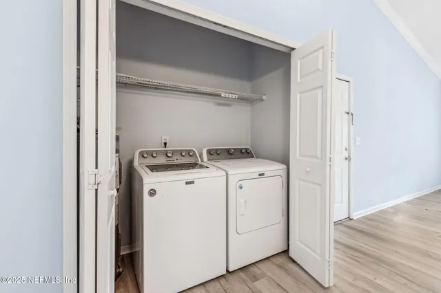 a view of a house with swimming pool and sitting area