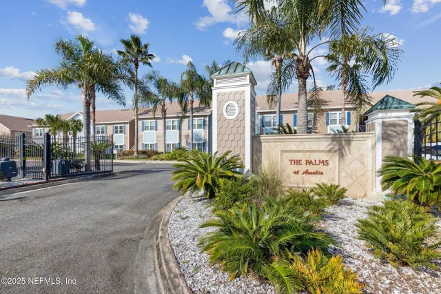 a view of a house with swimming pool and sitting area